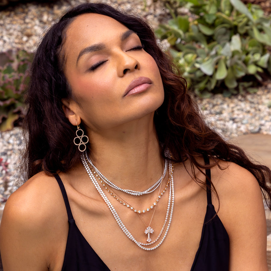 Shop the looks Canyon Life + Stone Canyon, diamond tennis necklace, pendants, rings, earrings, collections shown on a beautiful bathing suit clad woman basking in sunshine; 323-404-2959 for shop help